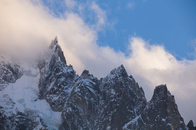 Panoramic view of snowcapped mountains against sky