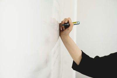 Hand writing on whiteboard