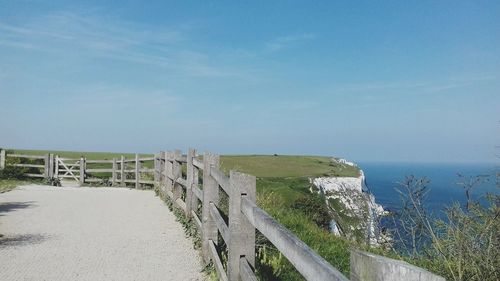 Scenic view of sea against clear blue sky