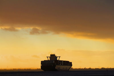 Container ship coming from the port of hamburg at willkomm höft in wedel