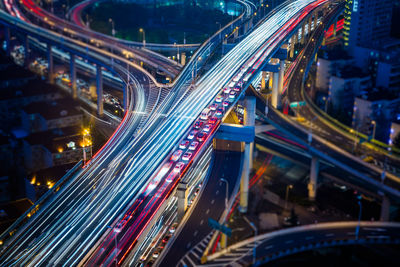 Light trails on road in city at night