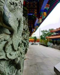 Close-up of statue against temple