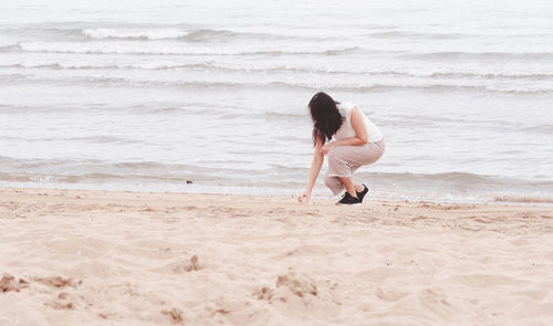 Woman standing on beach