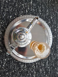 High angle view of tea in plate on marble