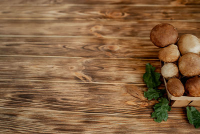 High angle view of peanuts on wooden table