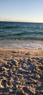 Scenic view of beach against clear sky