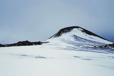 Scenic view of snowcapped mountain against sky