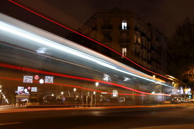 Light trails on road in city at night