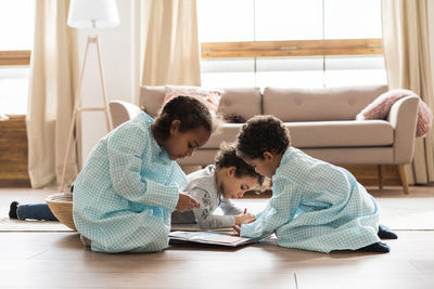 Siblings studying at home