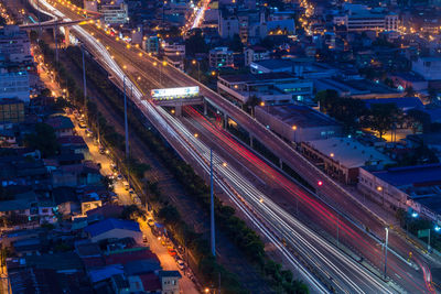 High angle view of light trails on road at night