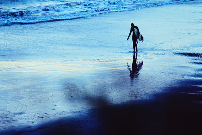 Full length of man walking on beach