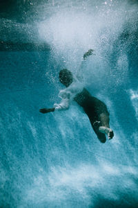 Dancer swimming in pool