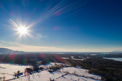 Scenic view of snow covered landscape against sky