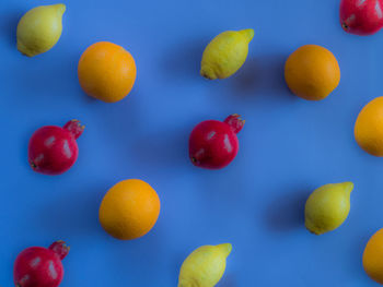 Close-up of fruits against blue background