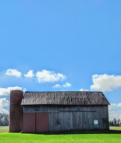 House on field against sky