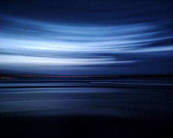 Full frame horizon over the sea with adamski effect in blue hour