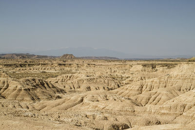 Scenic view of desert against clear sky