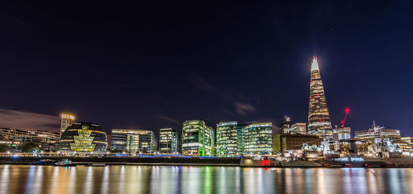 Illuminated buildings in city at night