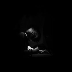 Man holding smart phone in darkroom