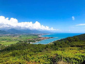 Scenic view of landscape against blue sky