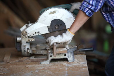 Close-up of man working on wood