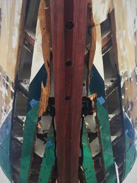 Panoramic shot of abandoned clothes hanging on wood