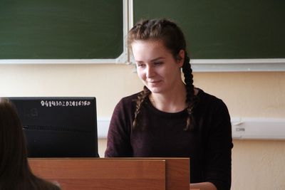 Woman using computer in classroom