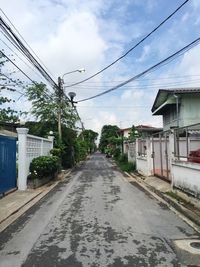 View of road against cloudy sky