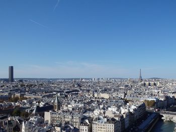 High angle view of paris against blue sky