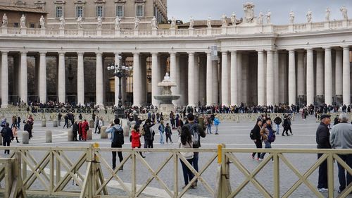 Group of people in front of historical building