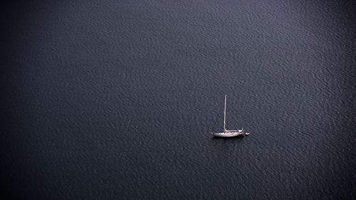 High angle view of sailboat sailing on sea