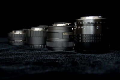 Close-up of camera lens on table against back background