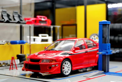 Red toy car on table