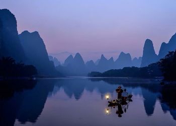 Scenic view of lake at sunset