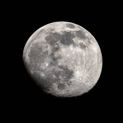 Low angle view of moon against sky at night