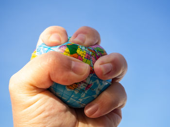 Close-up of hand holding ice cream