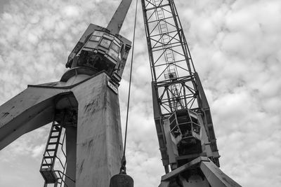 Low angle view of crane against sky