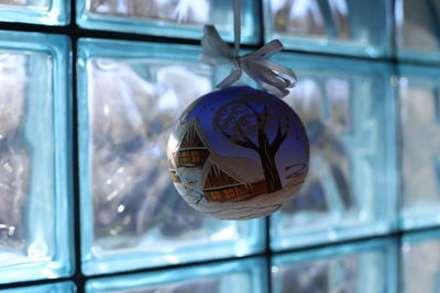 Close-up of glass window christmas bauble