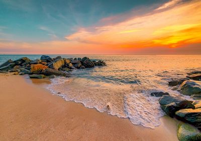 Scenic view of sea against sky during sunset