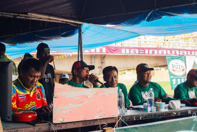 High angle view of people sitting at market