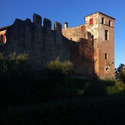 Low angle view of built structure against blue sky