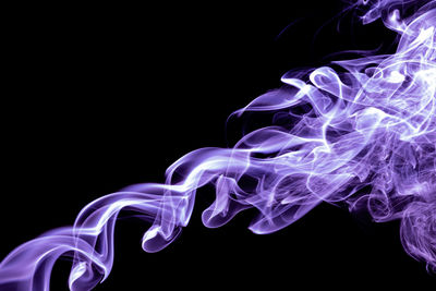 Purple color abstract smoke on black background