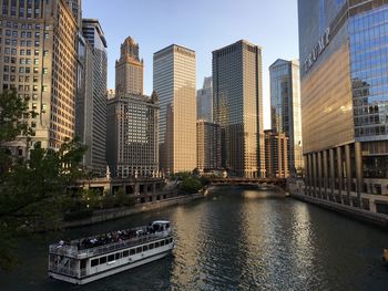 Modern buildings by river in city