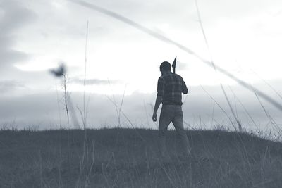 Full length of woman standing against sky