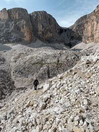 Hiker on the roda de valun, sella group, dolomites, south tyrol, italy 