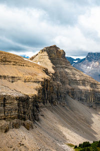 Sun casting shadows on remote mountain ridge near banff national park