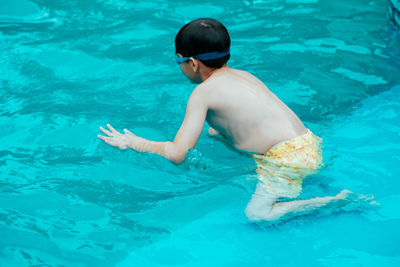 Man swimming in pool