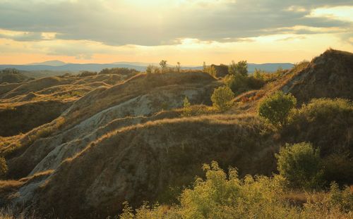 Scenic view of landscape against sky during sunset