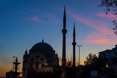 Low angle view of building against sky during sunset