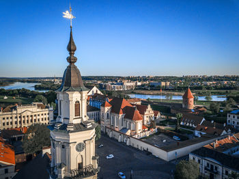 High angle view of buildings in city against clear sky